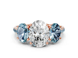 Rose gold Three-Stone Oval Cut Diamond Ring with Round with Aquamarine side stone Pavé Band and Prong Setting