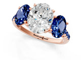 Rose gold Three-Stone Oval Cut Diamond Ring with Round with Blue Sapphire side stone Pavé Band and Prong Setting_1