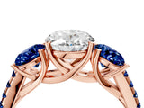 Rose gold Three-Stone Oval Cut Diamond Ring with Round with Blue Sapphire side stone Pavé Band and Prong Setting_4