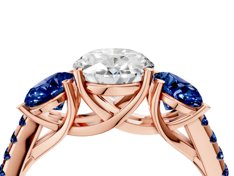 Rose gold Three-Stone Oval Cut Diamond Ring with Round with Blue Sapphire side stone Pavé Band and Prong Setting_4