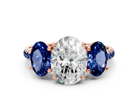 Rose gold Three-Stone Oval Cut Diamond Ring with Round with Blue Sapphire side stone Pavé Band and Prong Setting