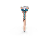 Rose gold Three-Stone Oval Cut Diamond Ring with Round with Blue Topaz side stone Pavé Band and Prong Setting_2