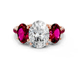 Rose gold Three-Stone Oval Cut Diamond Ring with Round with Garnet side stone Pavé Band and Prong Setting
