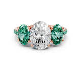 Rose gold Three-Stone Oval Cut Diamond Ring with Round with Green Sapphire side stone Pavé Band and Prong Setting