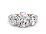 Rose gold Three-Stone Oval Cut Diamond Ring with Round with Moissanite side stone Pavé Band and Prong Setting