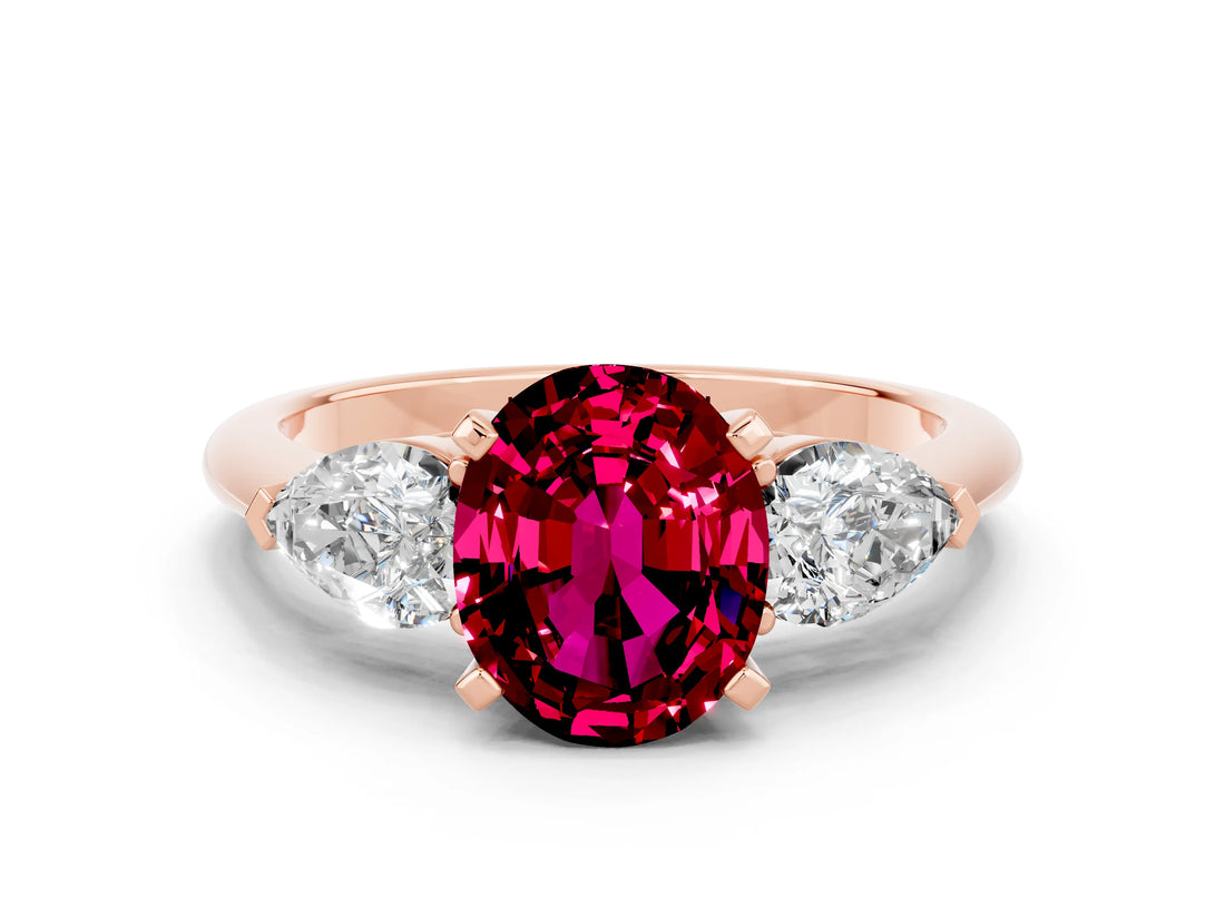 Rose gold Three-Stone Oval Cut Garnet Ring with Pear Side Stones and Four-Prong Setting