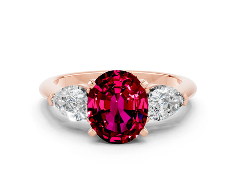 Rose gold Three-Stone Oval Cut Garnet Ring with Pear Side Stones and Four-Prong Setting