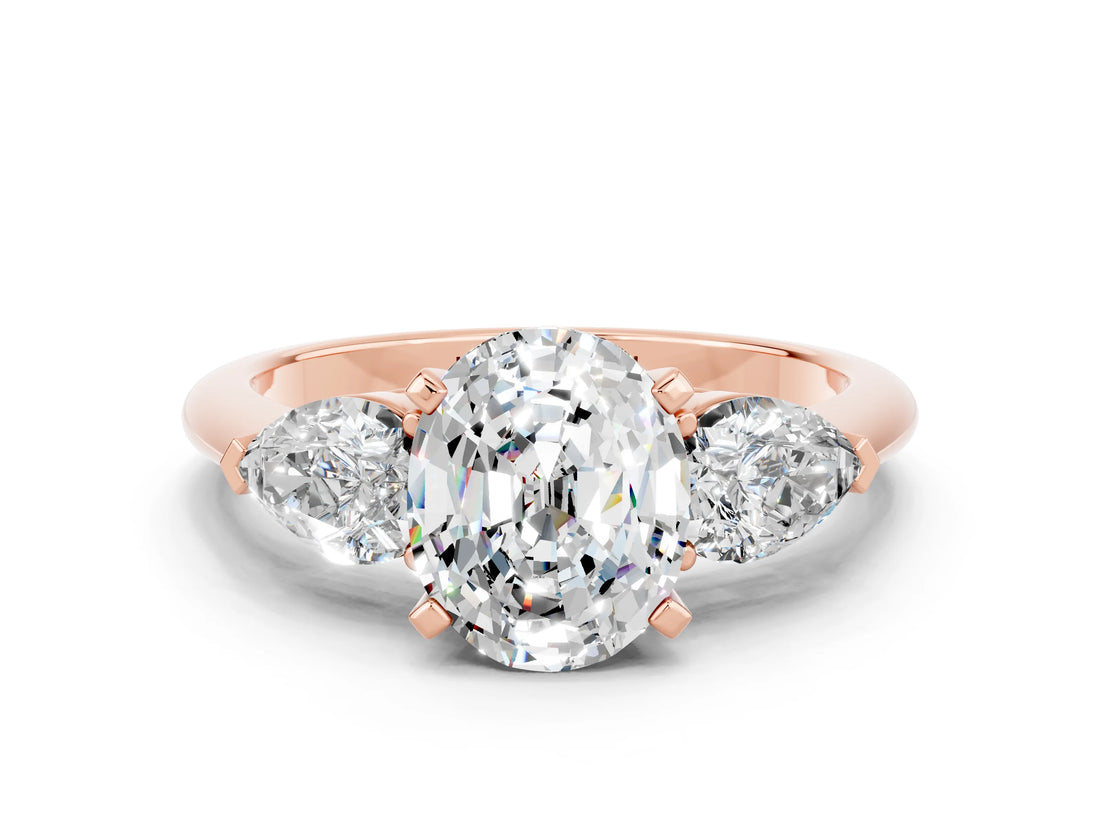 Rose gold Three-Stone Oval Cut Moissanite Ring with Pear Side Stones and Four-Prong Setting