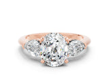 Rose gold Three-Stone Oval Cut Moissanite Ring with Pear Side Stones and Four-Prong Setting