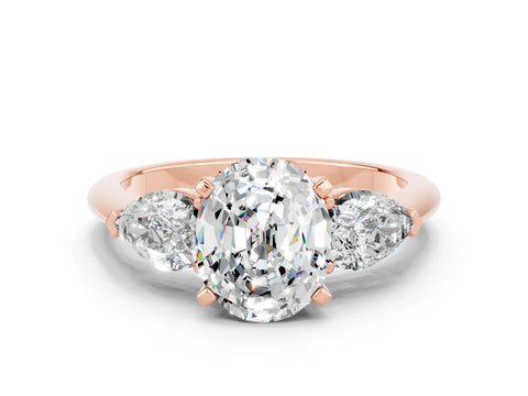 Rose gold Three-Stone Oval Cut Moissanite Ring with Pear Side Stones and Four-Prong Setting