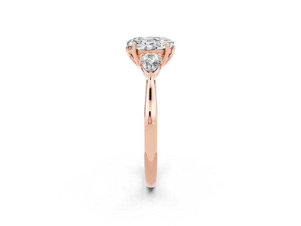 Rose gold Three-Stone Oval Cut Moissanite Ring with Pear  Side Stones in Four-Prong Setting