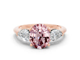 Rose gold Three-Stone Oval Cut Morganite Ring with Pear Side Stones and Four-Prong Setting