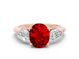 Rose gold Three-Stone Oval Cut Ruby Ring with Pear Side Stones and Four-Prong Setting