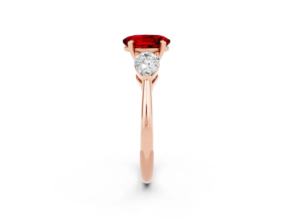 Rose gold Three-Stone Oval Cut Ruby Ring with Pear Side Stones and Four-Prong Setting