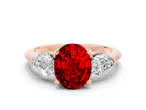Rose gold Three-Stone Oval Cut Ruby Ring with Pear Side Stones and Four-Prong Setting