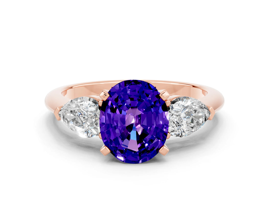 Rose gold Three-Stone Oval Cut Tanzanite Ring with Pear Side Stones and Four-Prong Setting