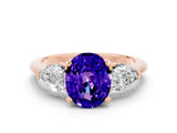 Rose gold Three-Stone Oval Cut Tanzanite Ring with Pear Side Stones and Four-Prong Setting