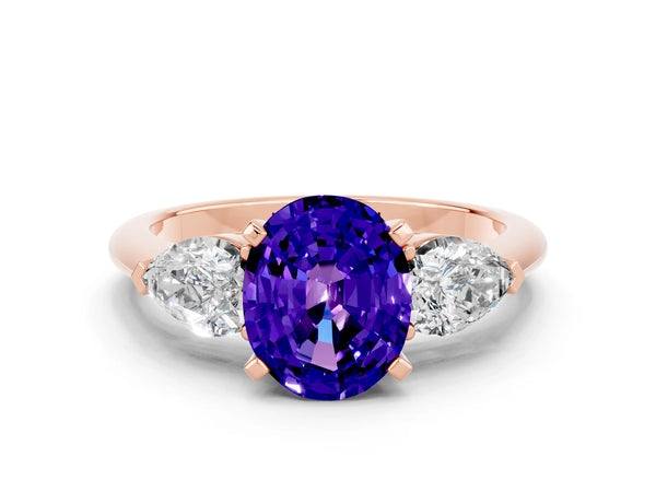 Rose gold Three-Stone Oval Cut Tanzanite Ring with Pear Side Stones and Four-Prong Setting