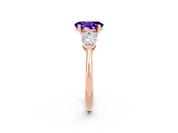 Rose gold Three-Stone Oval Cut Tanzanite Ring with Pear Side Stones and Four-Prong Setting