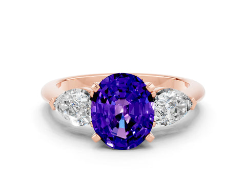 Rose gold Three-Stone Oval Cut Tanzanite Ring with Pear Side Stones and Four-Prong Setting