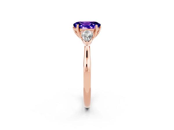 Rose gold Three-Stone Oval Cut Tanzanite Ring with Pear  Side Stones in Four-Prong Setting