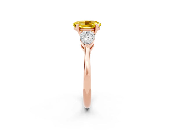 Rose gold Three-Stone Oval Cut Yellow Sapphire Ring with Pear Side Stones and Four-Prong Setting