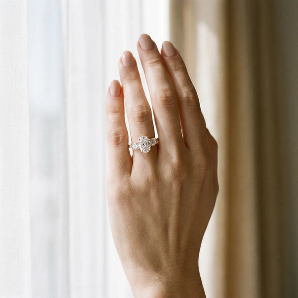 Rose gold Three-Stone Oval Diamond Channel Set Engagement Ring with Prong Setting