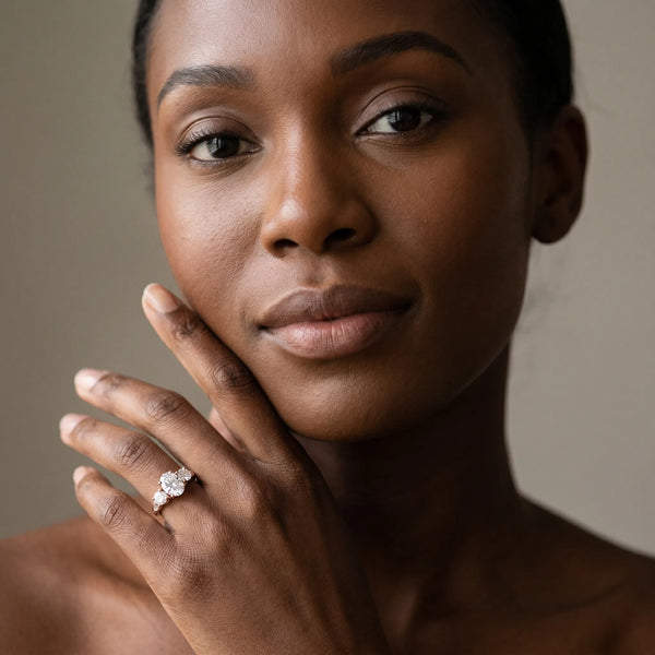 Rose gold Three-Stone Oval Diamond Engagement Ring with Prong Setting on a Classic Band