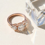 Rose gold Three-Stone Oval Diamond Engagement Ring with Prong Setting on a Classic Band_6