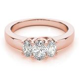 Rose gold Three-Stone Oval Diamond Ring with Channel Band and Prong Setting 1