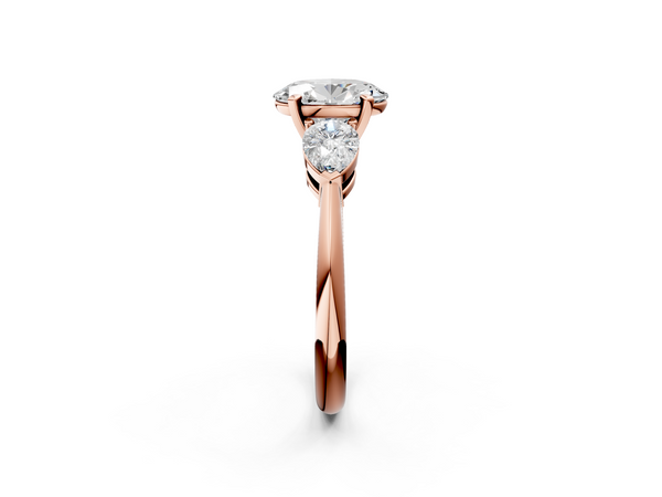 Rose gold Three-Stone Oval Cut Diamond Ring with Pear Side Stones and Four-Prong Setting