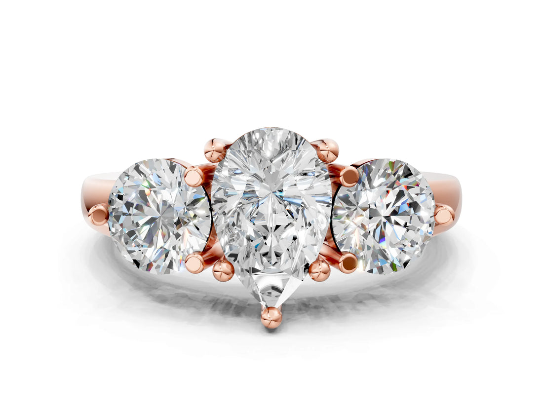 Rose gold Three-Stone Pear Brilliant Cut Solitaire Ring with Prong Setting on a Classic Band