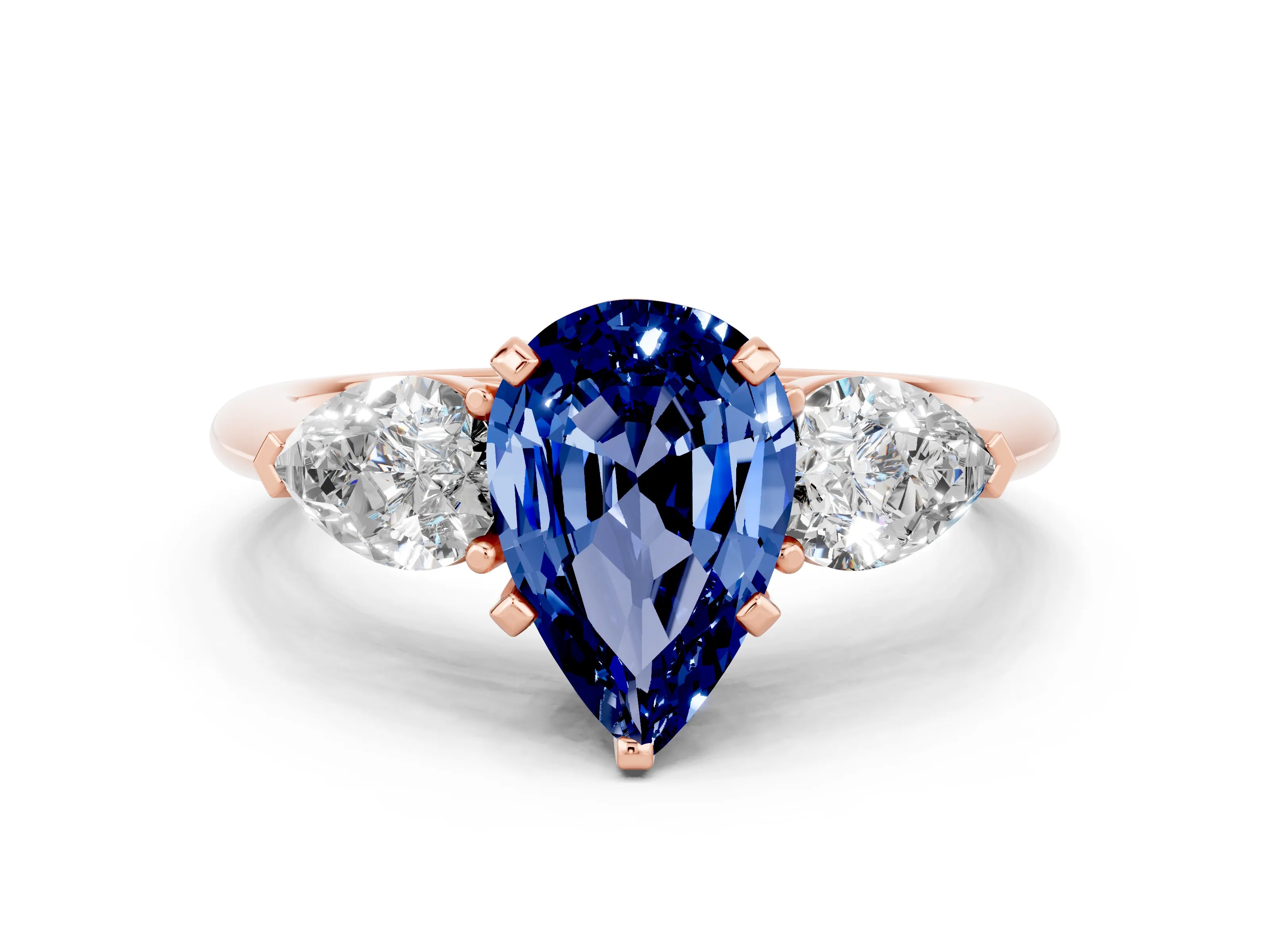 Rose gold Three-Stone Pear Cut Blue Sapphire Ring with Pear Side Stones and Four-Prong Setting