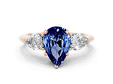Rose gold Three-Stone Pear Cut Blue Sapphire Ring with Pear Side Stones and Four-Prong Setting
