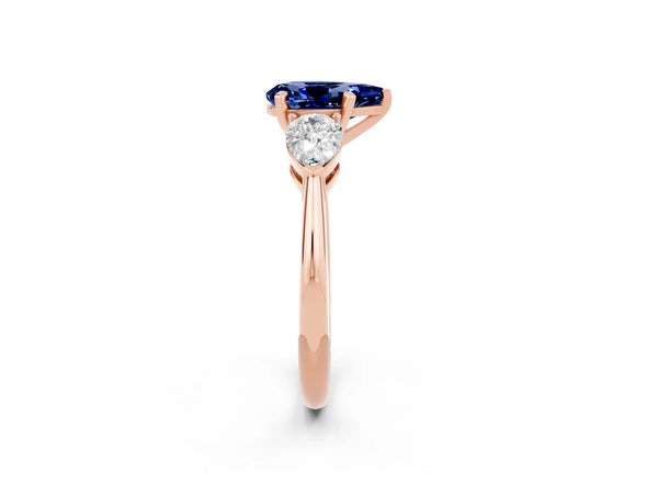 Rose gold Three-Stone Pear Cut Blue Sapphire Ring with Pear Side Stones and Four-Prong Setting