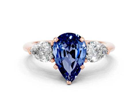 Rose gold Three-Stone Pear Cut Blue Sapphire Ring with Pear Side Stones and Four-Prong Setting