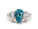 Rose gold Three-Stone Pear Cut Blue Topaz Ring with Pavé Band and Prong Setting_12