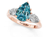 Rose gold Three-Stone Pear Cut Blue Topaz Ring with Pear Side Stones and Four-Prong Setting_1
