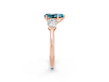 Rose gold Three-Stone Pear Cut Blue Topaz Ring with Pear Side Stones and Four-Prong Setting_2