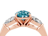 Rose gold Three-Stone Pear Cut Blue Topaz Ring with Pear Side Stones and Four-Prong Setting_4