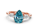 Rose gold Three-Stone Pear Cut Blue Topaz Ring with Pear  Side Stones in Four-Prong Setting_12