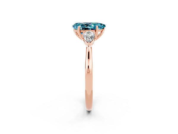 Rose gold Three-Stone Pear Cut Blue Topaz Ring with Pear  Side Stones in Four-Prong Setting