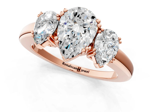 Rose gold Three-Stone Pear Cut Cut Diamond Ring with Channel Set Band and Four-Prong Setting
