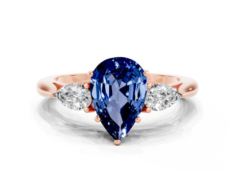 Rose gold Three-Stone Pear Cut Cut Diamond Ring with Pear Side Stones in Four-Prong Setting