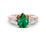 Rose gold Three-Stone Pear Cut Cut Diamond Ring with Trillion Side Stones and Four-Prong Setting