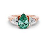 Rose gold Three-Stone Pear Cut Cut Diamond Ring with Trillion Side Stones and Four-Prong Setting