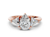 Rose gold Three-Stone Pear Cut Cut Diamond Ring with Trillion Side Stones and Four-Prong Setting_3