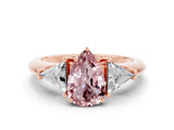 Rose gold Three-Stone Pear Cut Cut Diamond Ring with Trillion Side Stones and Four-Prong Setting