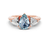 Rose gold Three-Stone Pear Cut Cut Diamond Ring with Trillion Side Stones and Four-Prong Setting