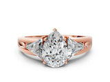 Rose gold Three-Stone Pear Cut Cut Diamond Ring with Trillion Side Stones on a Split Shank Band_13